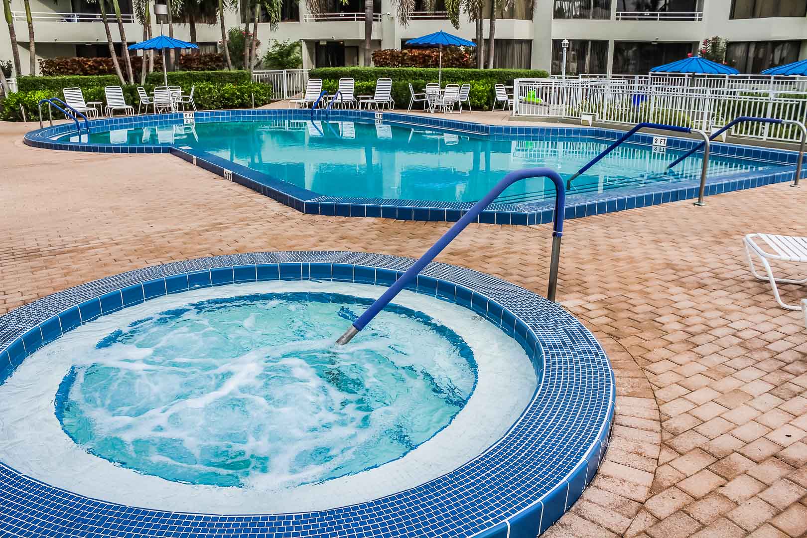 A refreshing Pool and Jacuzzi at VRI's Berkshire by the Sea in Florida.